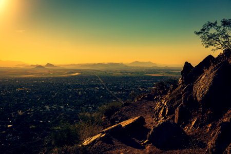 photo of city by rock formations