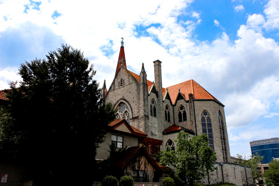 brown and white concrete church under blue sky during daytime