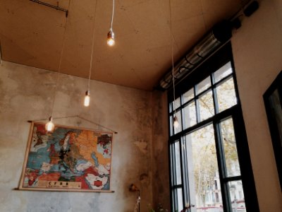 gray pendant lamps inside concrete building at daytime