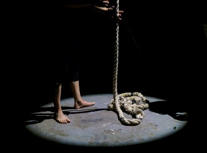 man holding brown rope photo