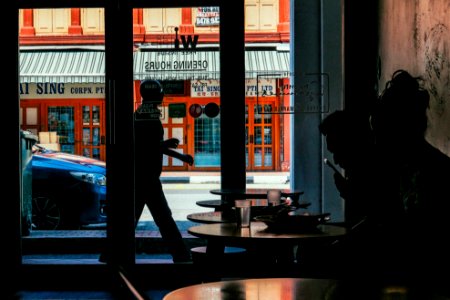 two person inside building near glass door during daytime photo