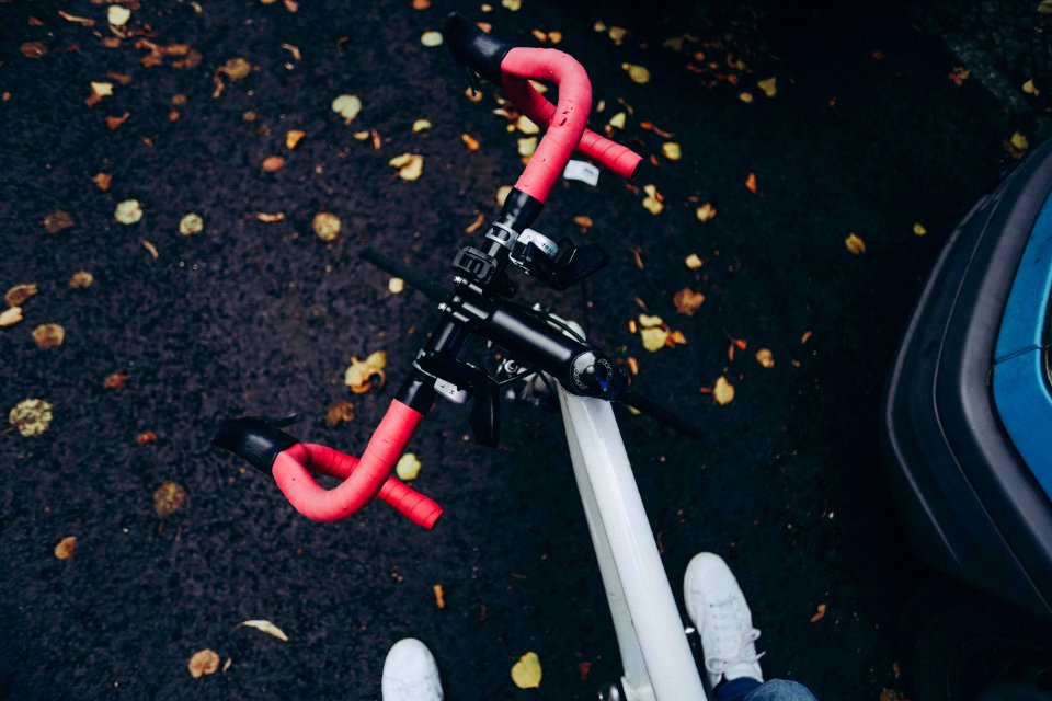 photo of red and gray bicycle