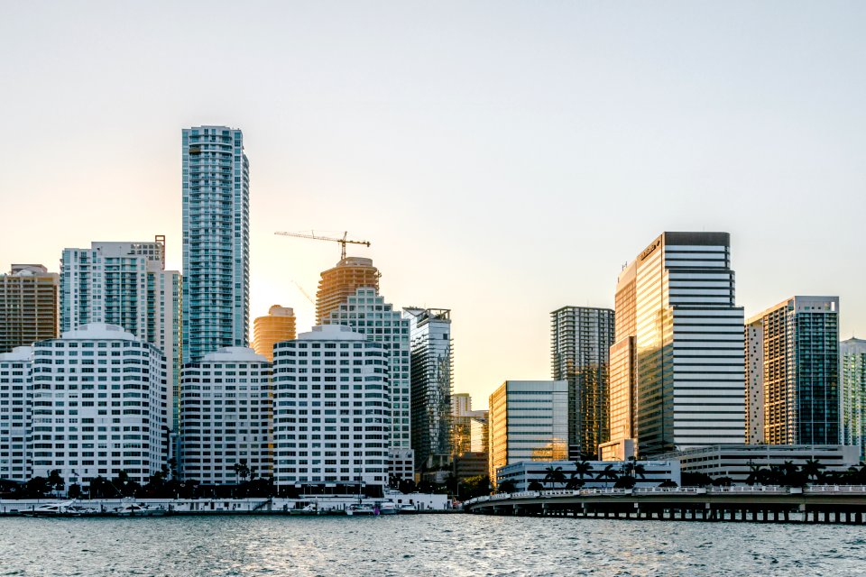 white concrete buildings near body of water at daytime photo