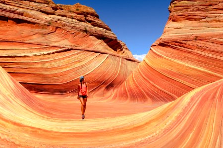 woman walking near canyon photo