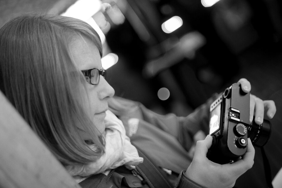 Photographer woman gray camera