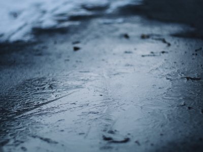 water droplets on gray concrete floor