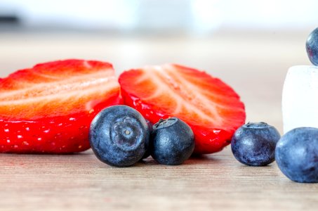 selective focus photography of strawberry and blueberries