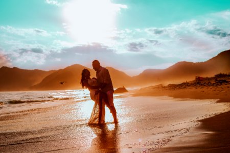 couple walking in seashore photo