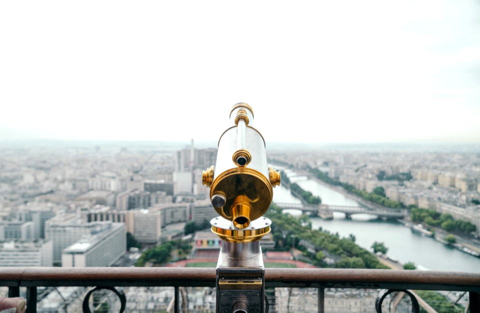 gray and gold-colored telescope on roof photo