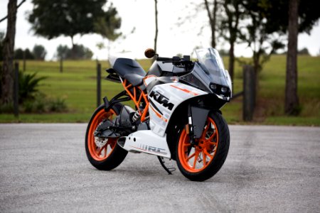 white and orange KTM sports bike selective focus photography