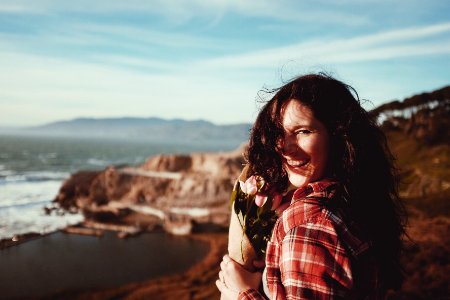 woman holding pink tulips photo