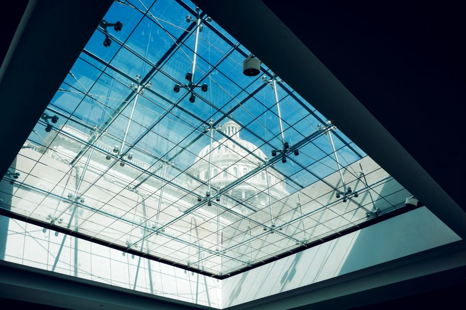 low angle photography of glass building