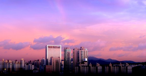 city buildings under cloudy sky