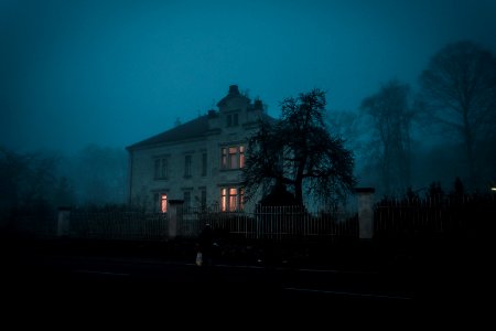 person walking towards house