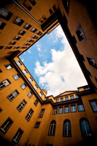 low-angle photography of yellow concrete building