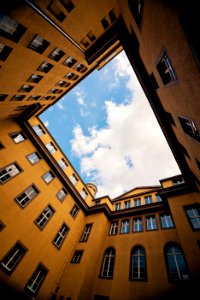 low-angle photography of yellow concrete building photo