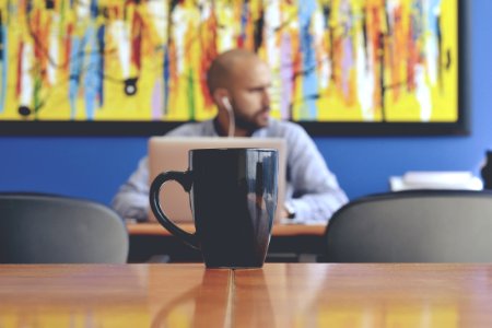 black mug on table photo