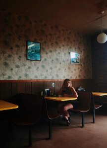 woman sitting on restaurant photo
