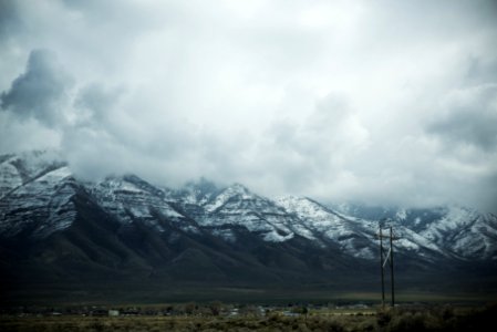 gray mountain with cloudy sky