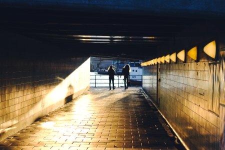 two person walking on hallway photo