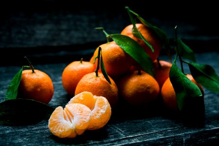 oranges on top of gray wooden table photo