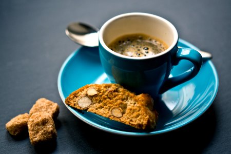 cup of coffee and bread on saucer closeup photography photo