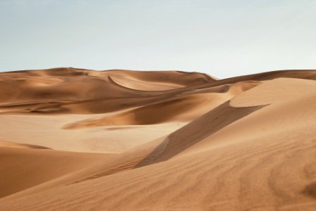 desert under clear blue sky during daytime photo