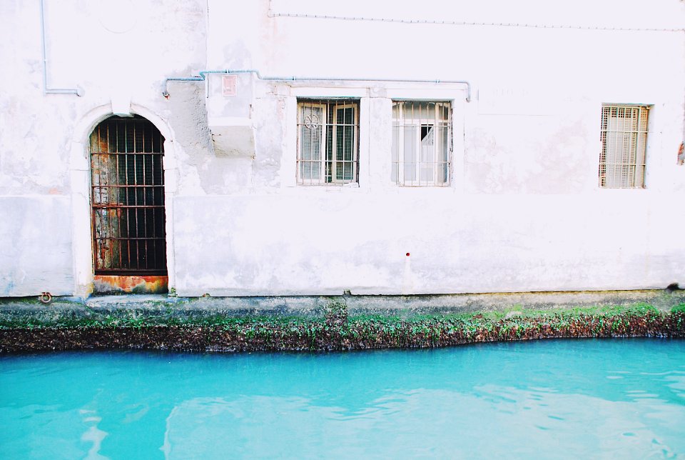 body of water beside white concrete house] photo