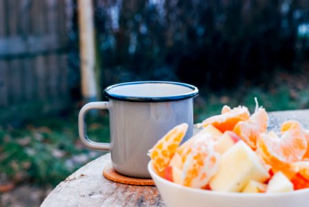 grey mug on brown wooden table photo