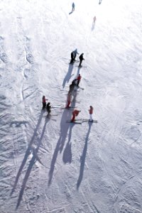 people skiing on snow during daytime photo