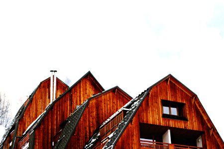 low angle photo of brown wooden house