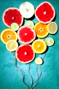 assorted fruit slices decor on teal surface