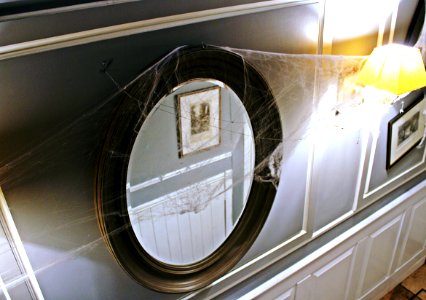 round black-framed mirror photo