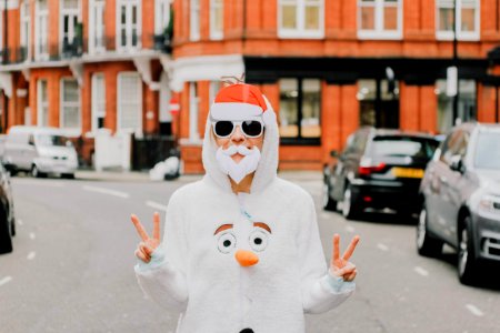 person wearing a Santa Claus mask and photo