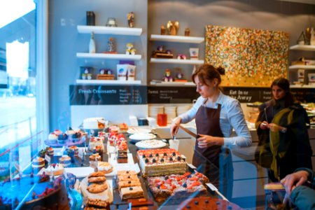 woman slicing cake photo