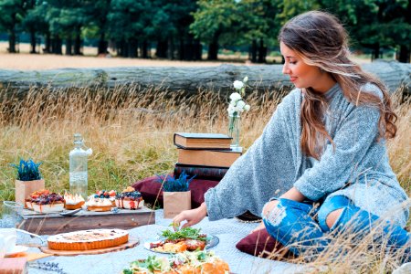 woman sitting on picnic mat photo