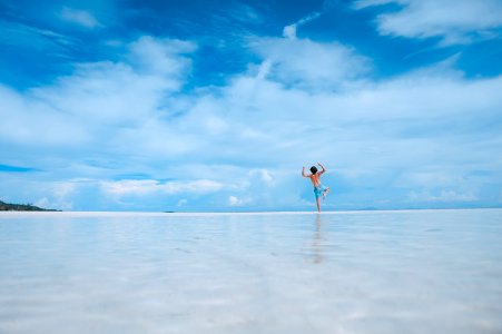 person standing in body of water photo