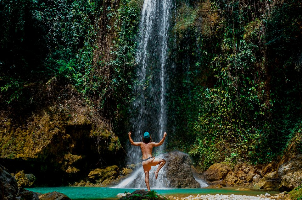 person near waterfalls