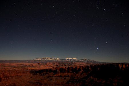 brown mountains under blue sky during night time photo