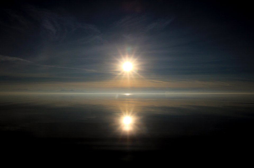 sun setting over the horizon