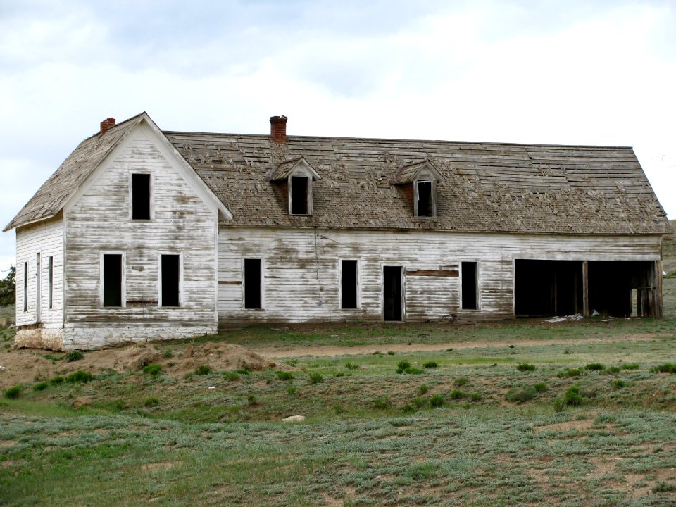 photography of white and grey house
