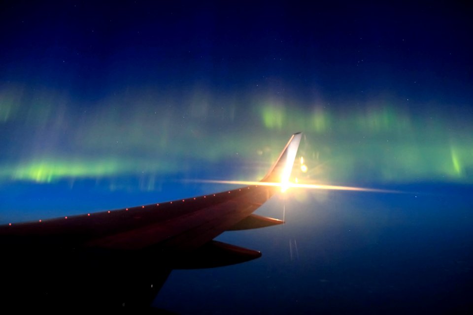 airplane wing under blue sky photo