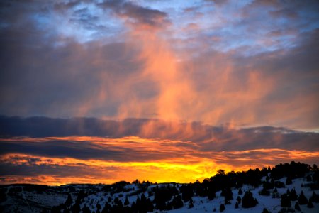 mountain with snow during sunset photo