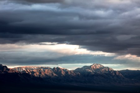 mountain under nimbus cloud photo