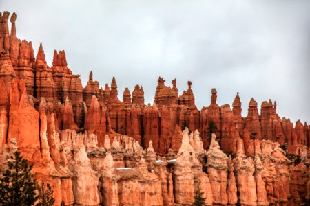brown rock formation under white clouds during daytime photo