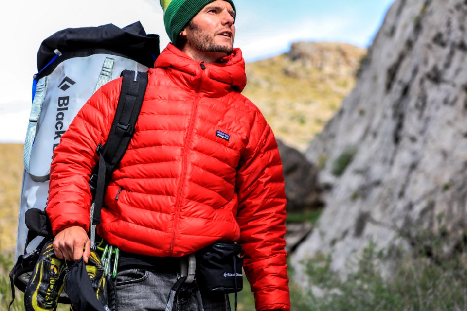 man looking above carrying gray camping backpack photo