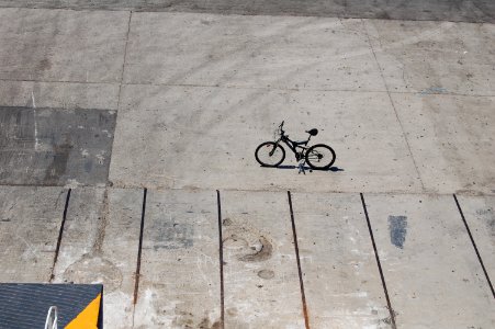 black bicycle parked on road photo