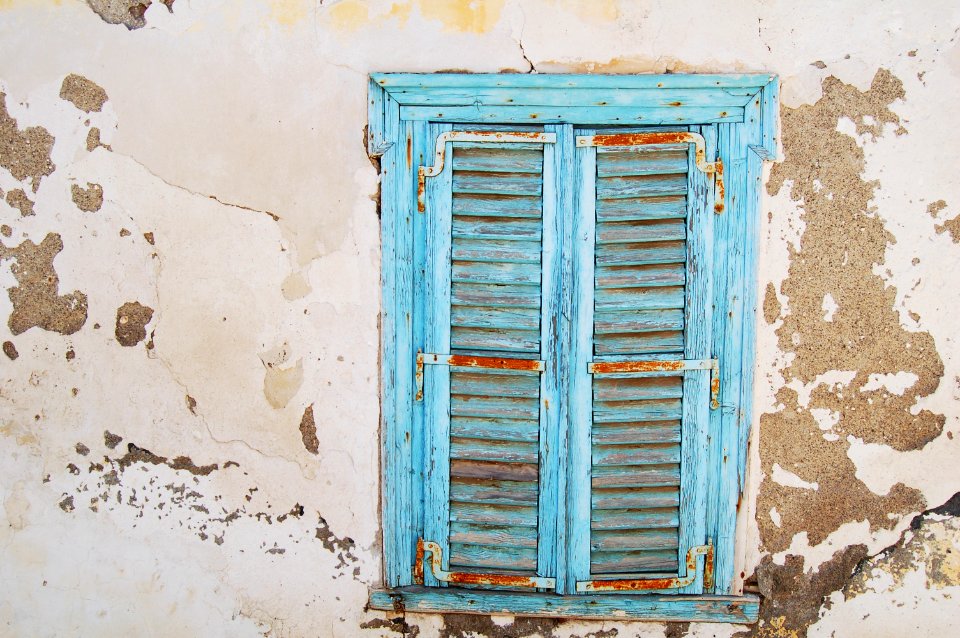 blue wooden louvered door window