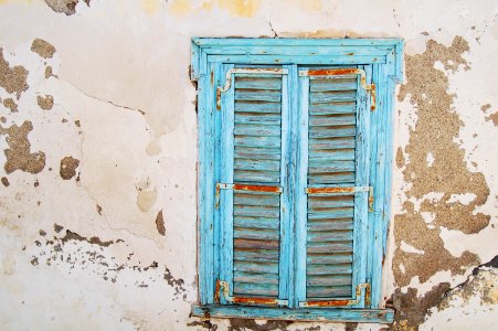 blue wooden louvered door window