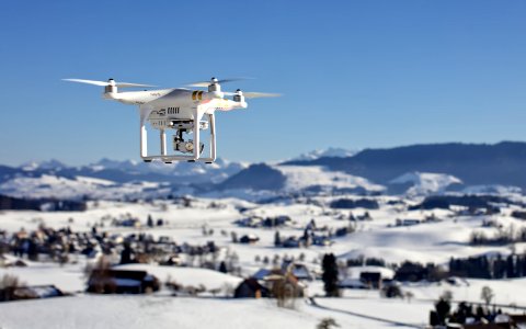 drone over snow covered houses photo